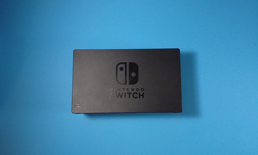 Nintendo Switch Dock on a blud surface