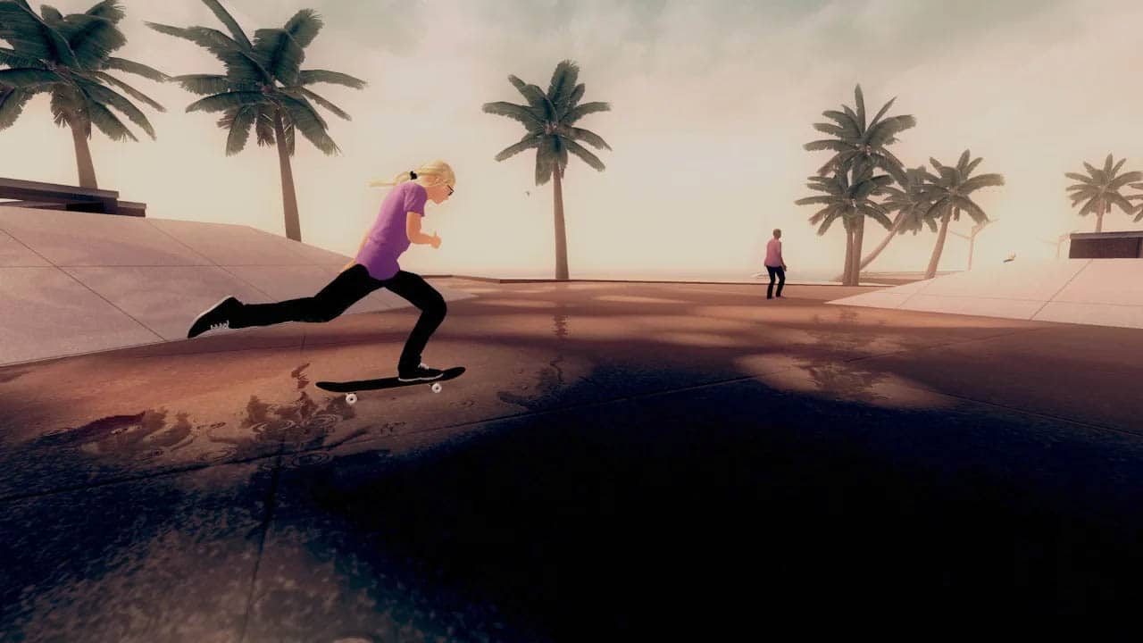 A skater skating in a an urban beach area with palm trees in the background