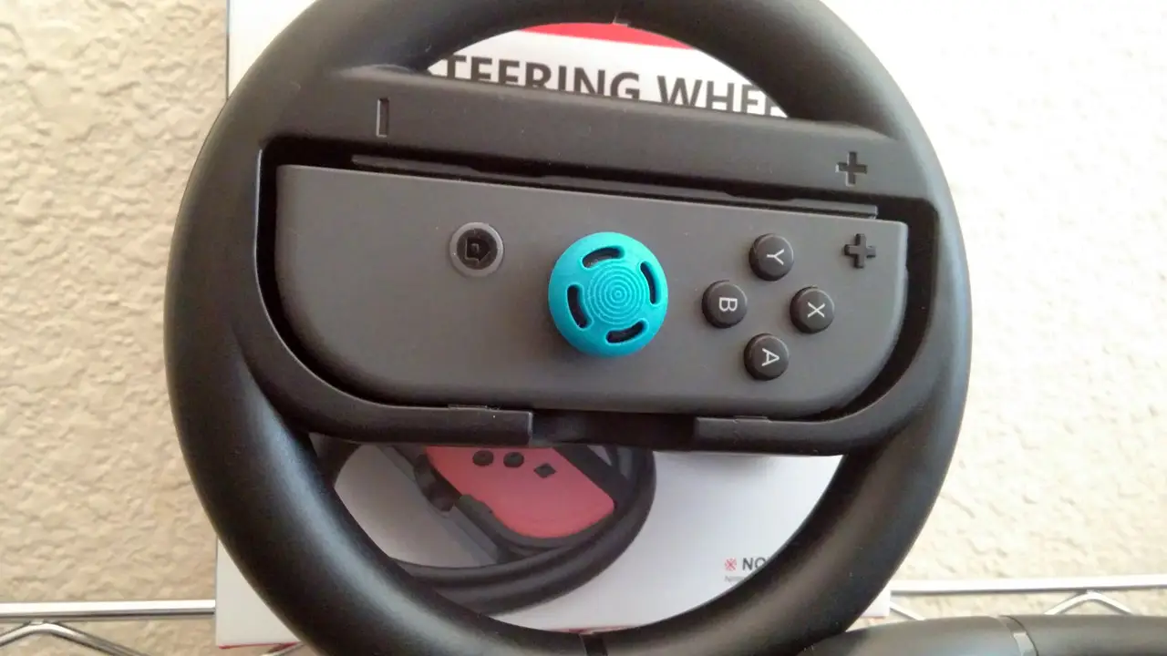 a close up of a nintendo switch steering wheel controller accessory