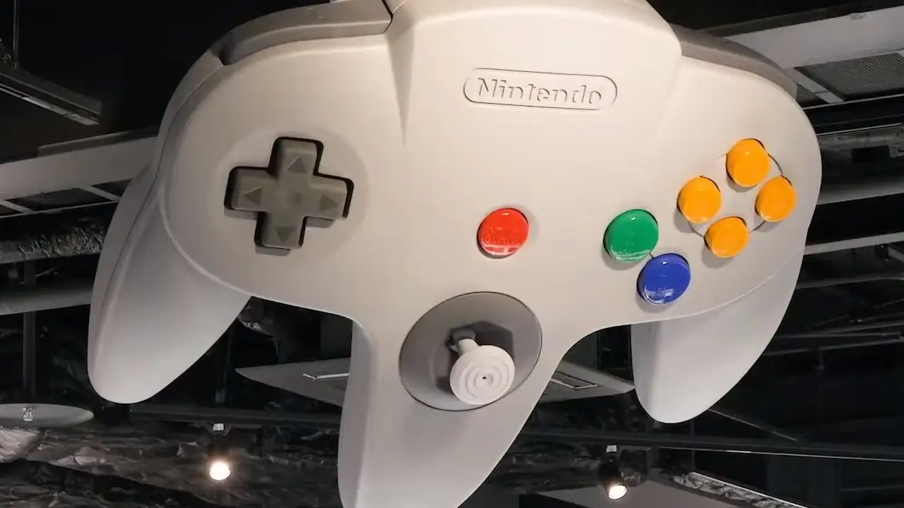 giant Nintendo 64 controller hanging on wall