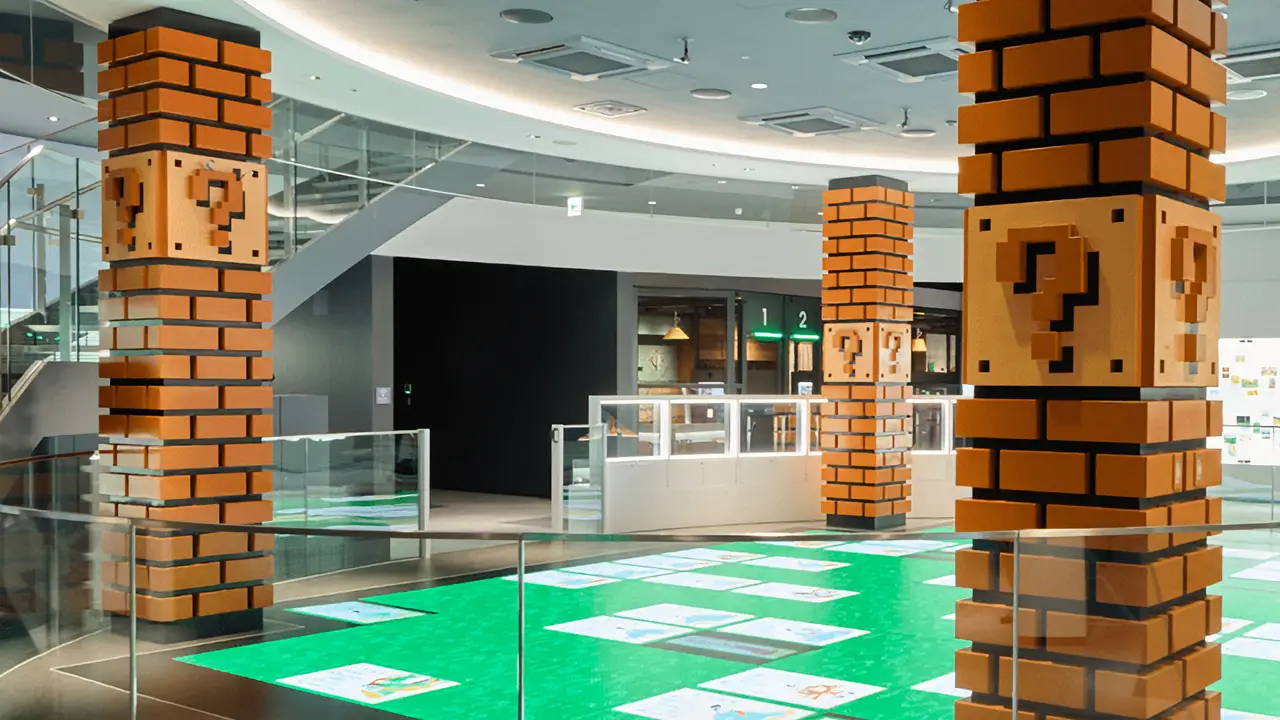 Nintendo Museum's first floor lobby with brick pillars and inviting lighting